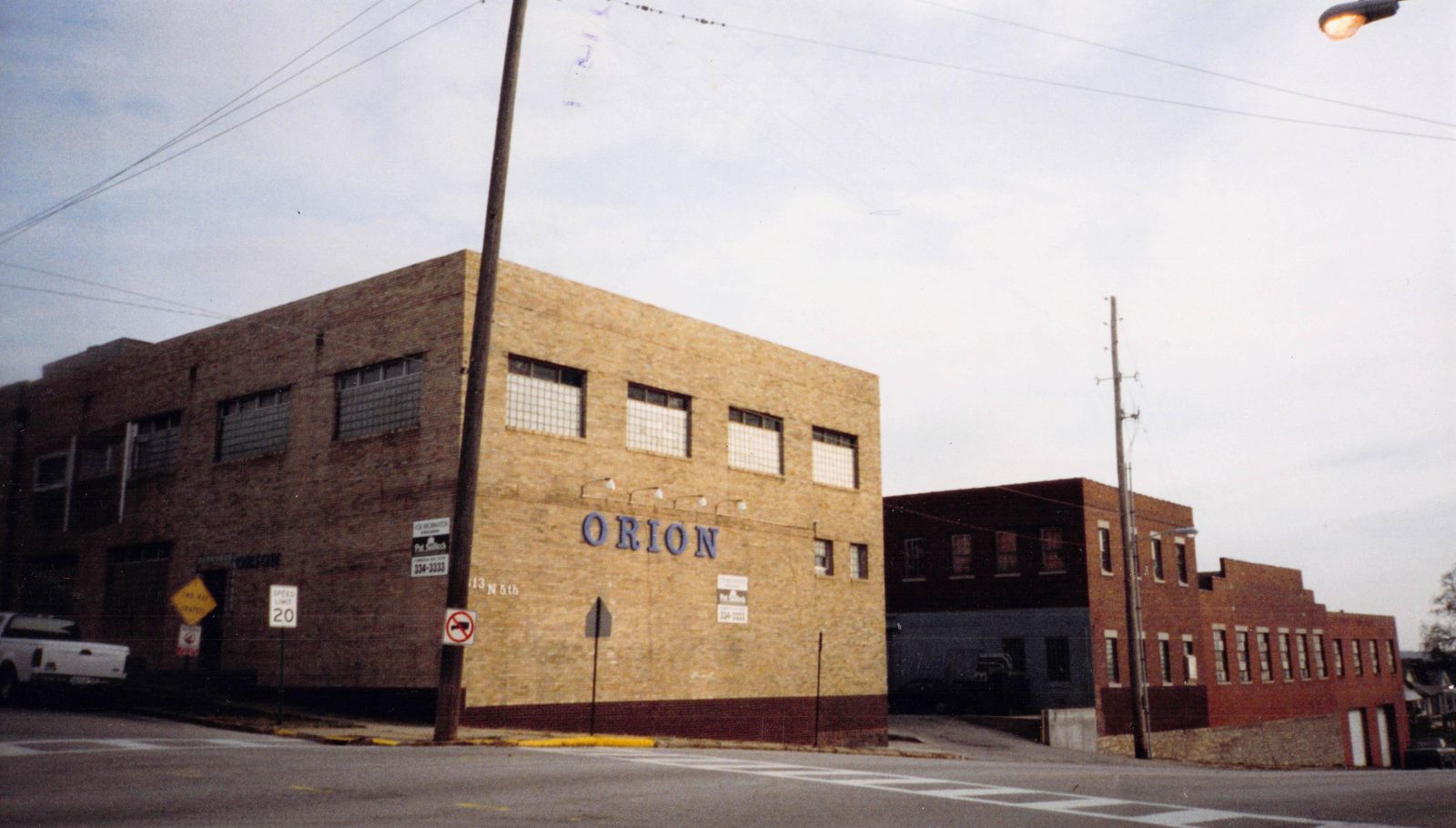 The building at 613 N. 5th Street with ORION painted in blue on its tan-brick facade